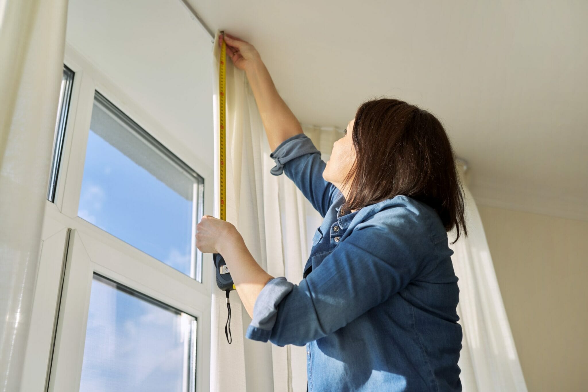 Hang curtains or blinds