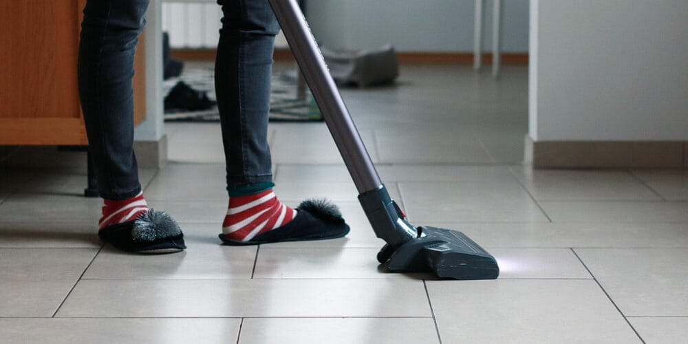 Clean with a vacuum cleaner / broom